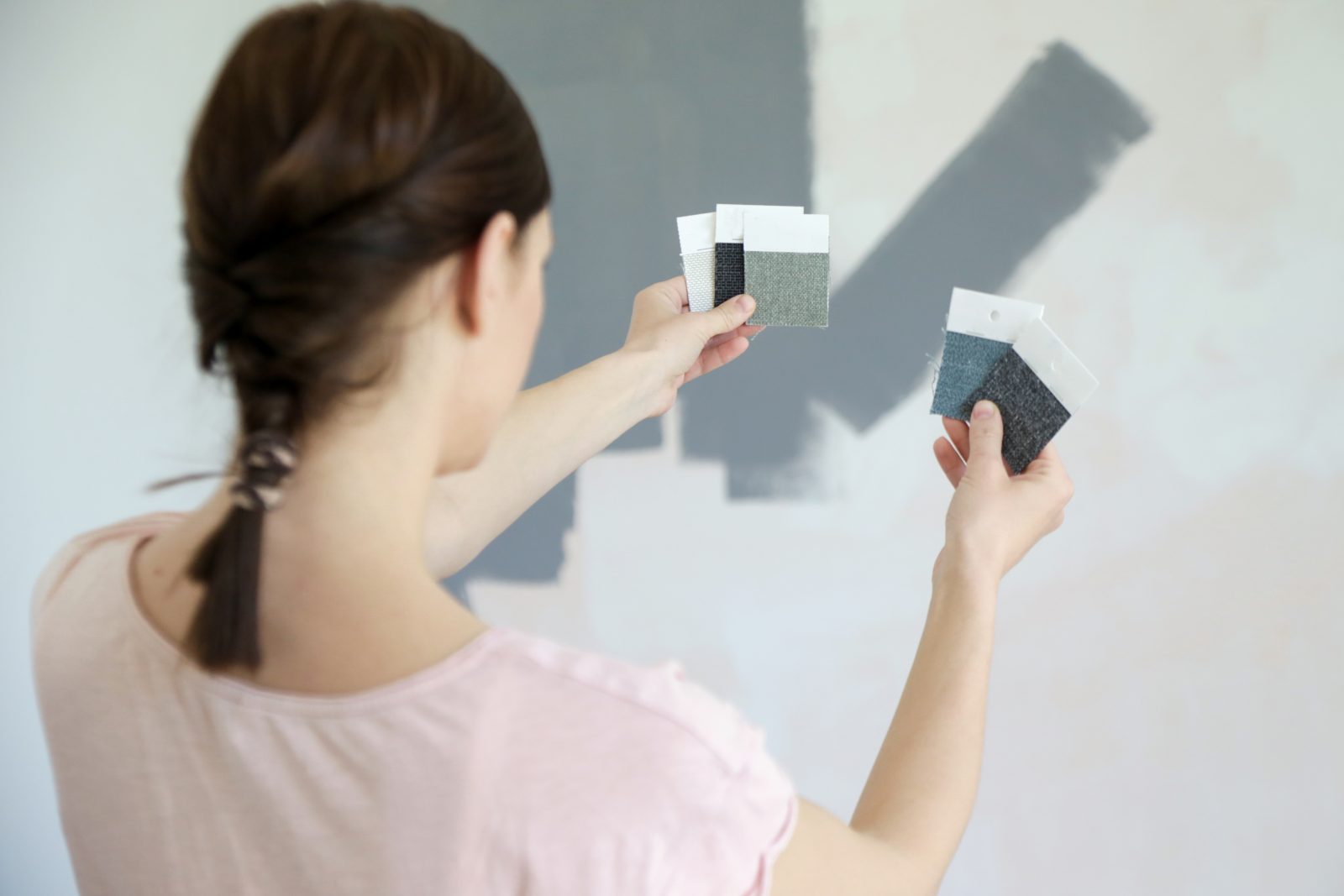 girl choosing paint colors